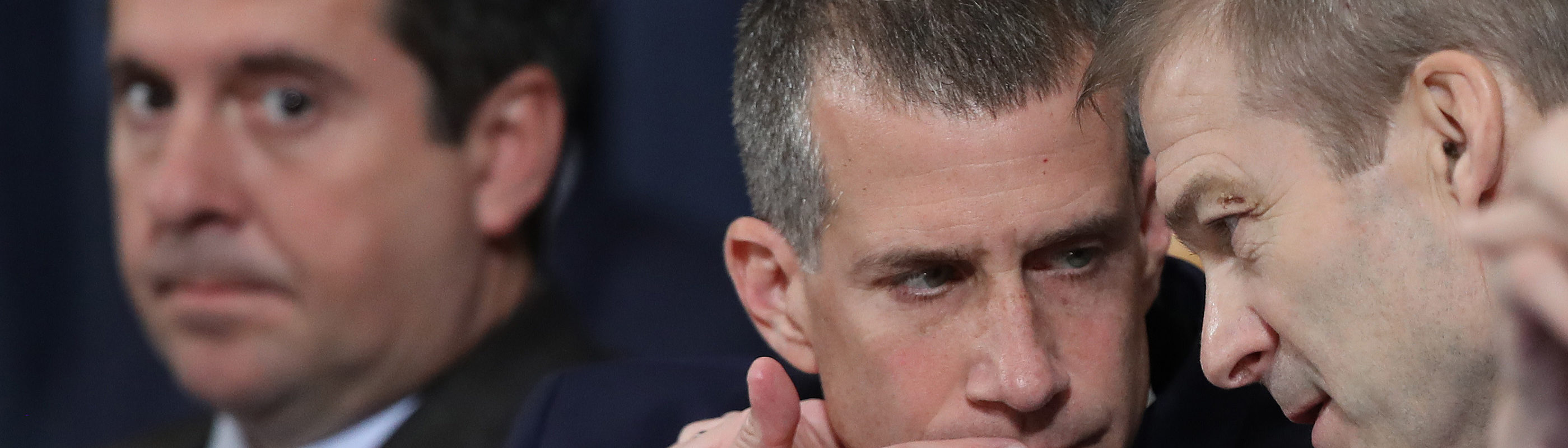 Ranking member Rep. Devin Nunes (R-CA) watches minority counsel Steve Castor and Rep. Jim Jordan (R-OH) confer during a House Intelligence Committee meeting in the Longworth House Office Building on Capitol Hill November 19, 2019 in Washington, DC.